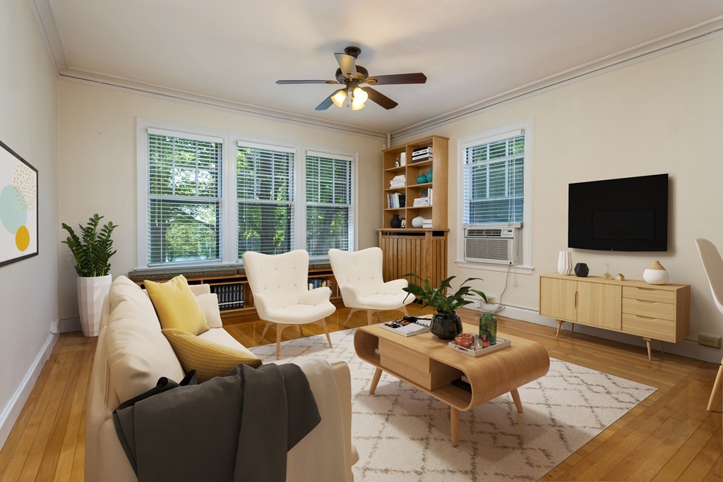 34 Ash Street, Unit 204 Cambridge, MA 02138 - Photo 1 of 10 a living room with furniture and a flat screen tv