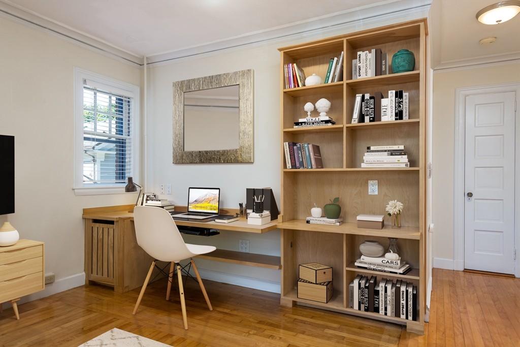34 Ash Street, Unit 204 Cambridge, MA 02138 - Photo 3 of 10 a workspace with furniture window and wooden floor