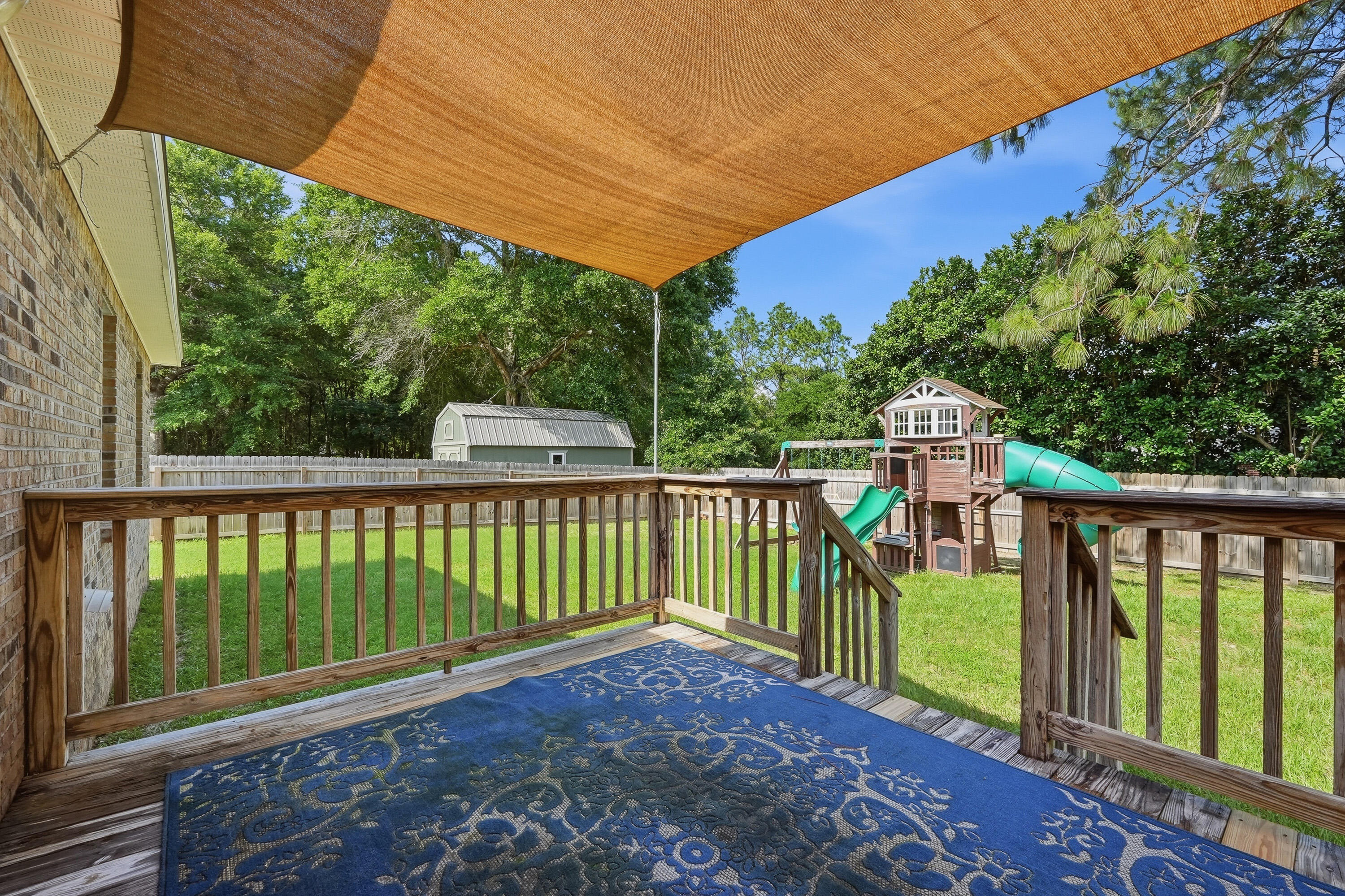 3033 Cabela Lane Crestview, FL 32539 - Photo 30 of 32 a view of a two chairs in the deck