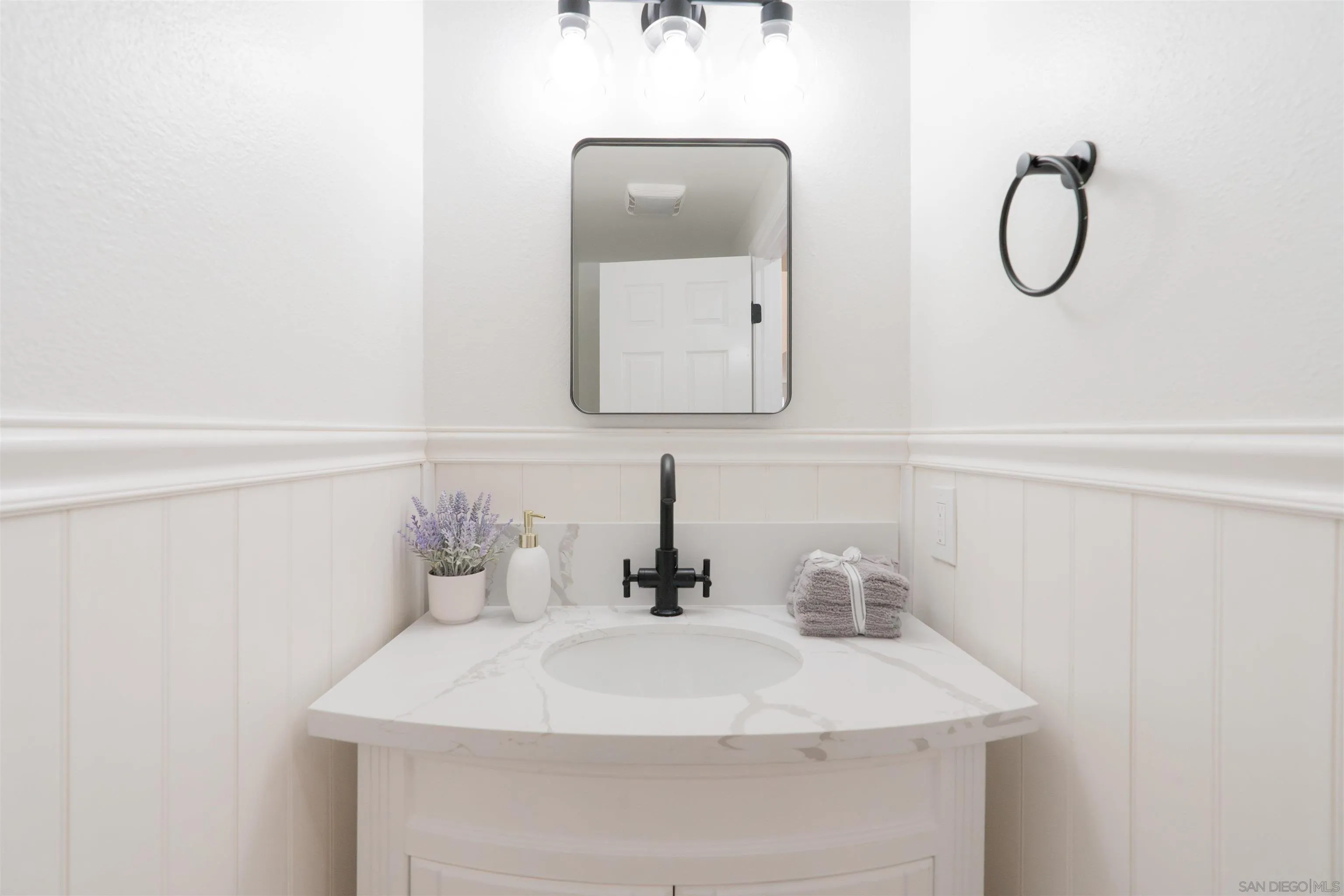 359 Compass Road Oceanside, CA 92054 - Photo 13 of 59 a bathroom with a sink and a mirror