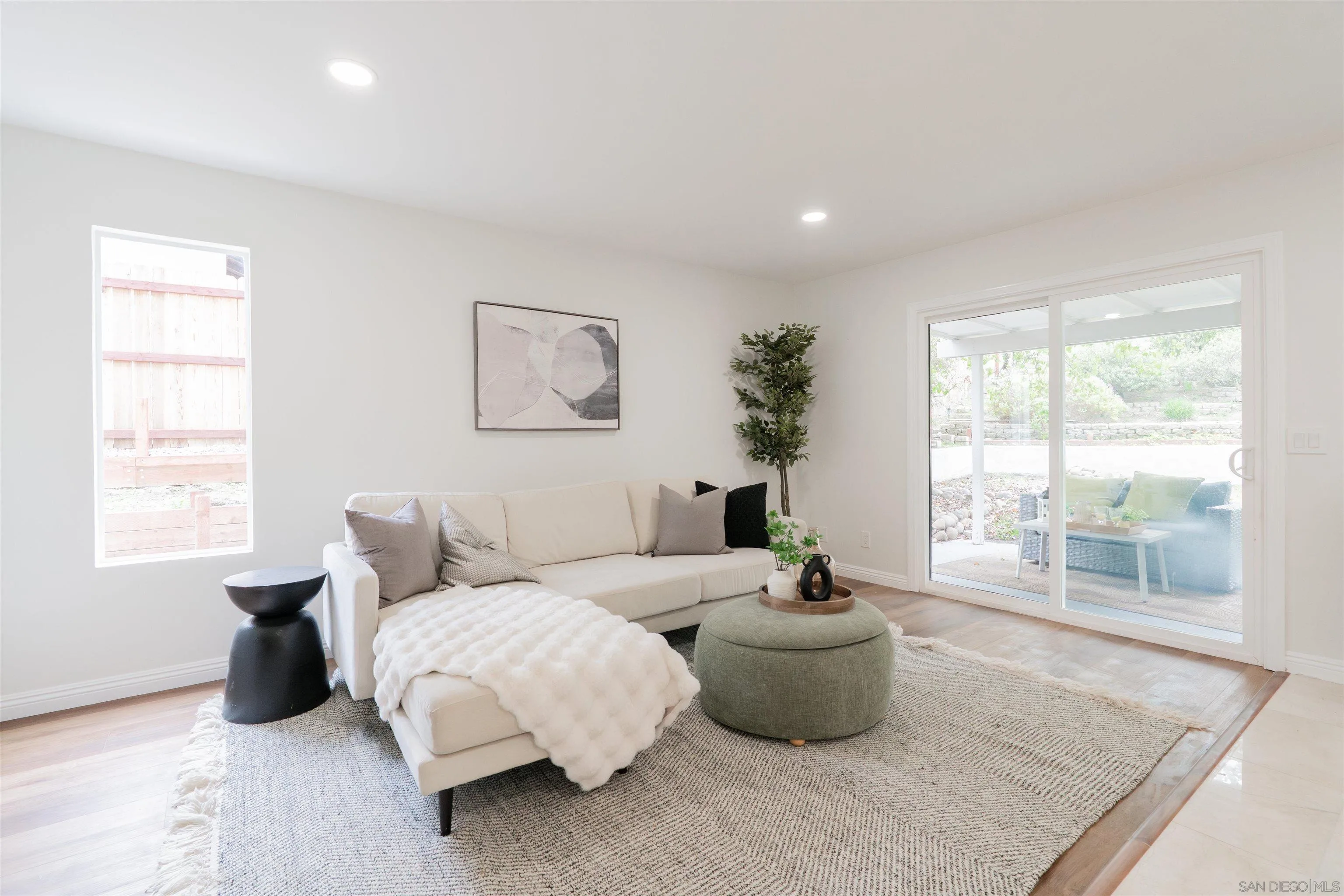 359 Compass Road Oceanside, CA 92054 - Photo 17 of 59 a living room with furniture and a large window