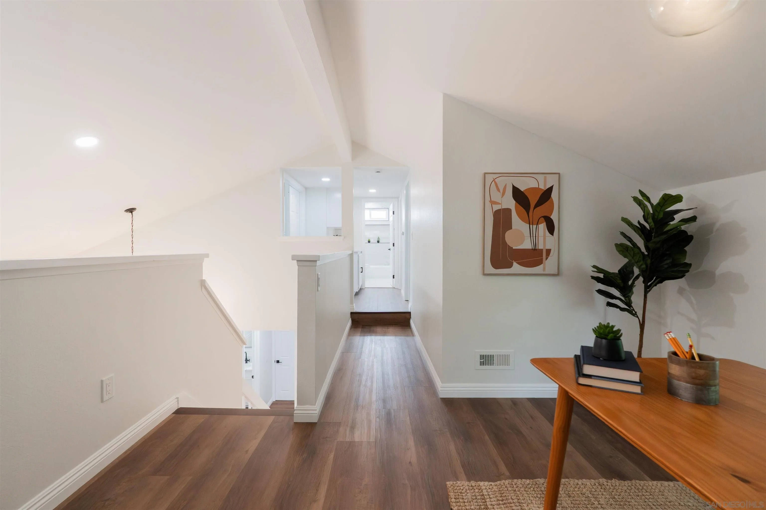 359 Compass Road Oceanside, CA 92054 - Photo 31 of 59 a view of a room with wooden floor and potted plant