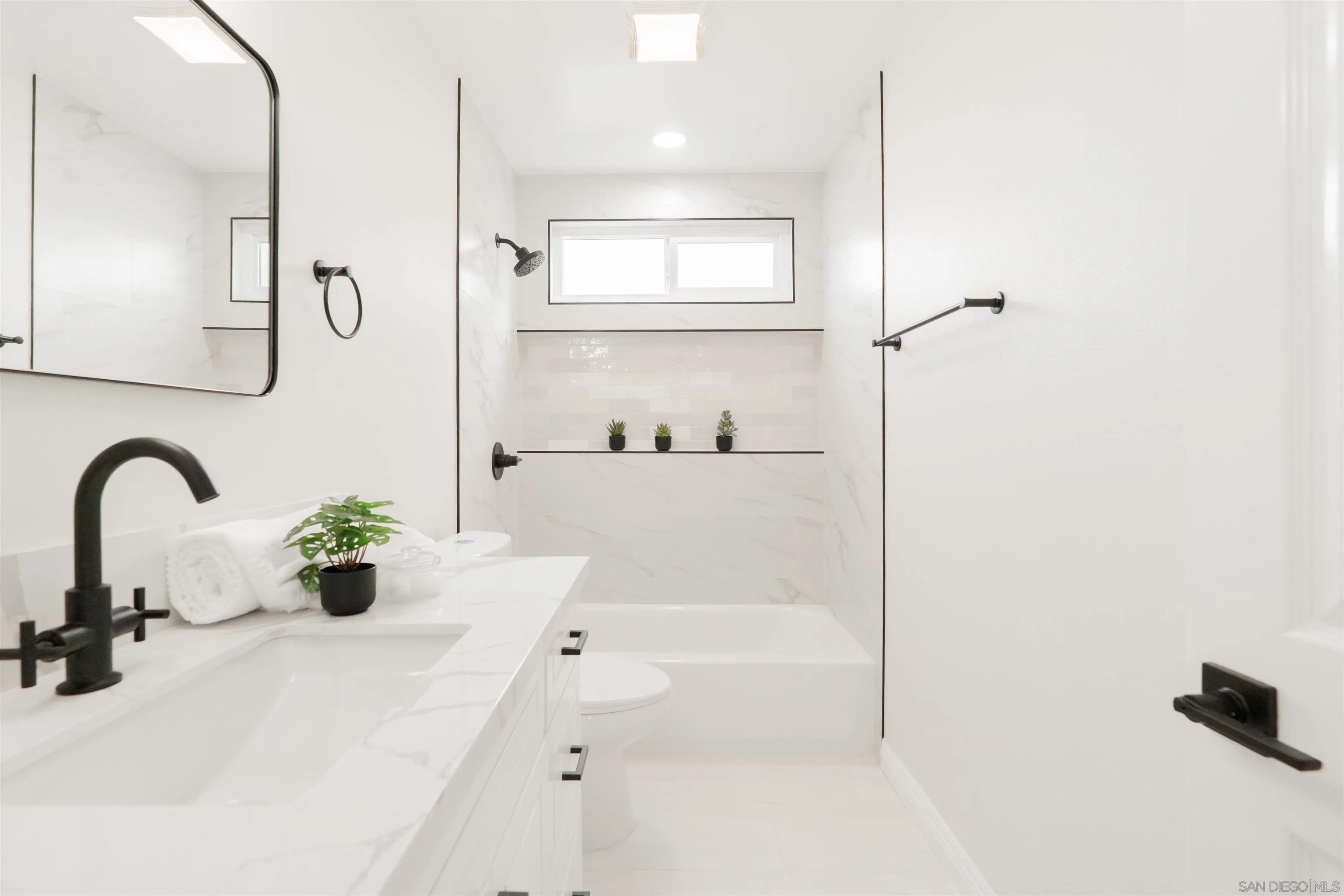 359 Compass Road Oceanside, CA 92054 - Photo 39 of 59 a bathroom with a sink a bathtub and a shower