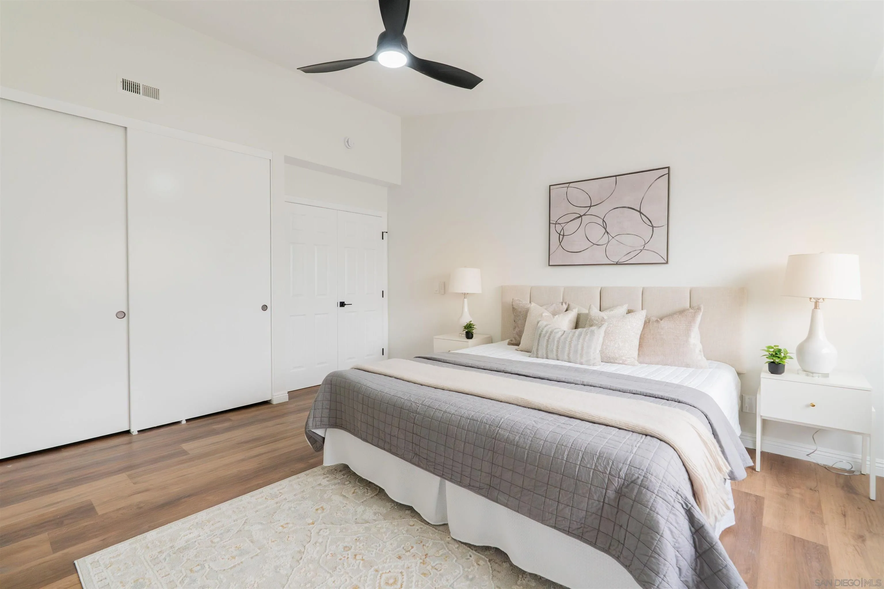 359 Compass Road Oceanside, CA 92054 - Photo 42 of 59 a bedroom with a bed and a painting on the wall