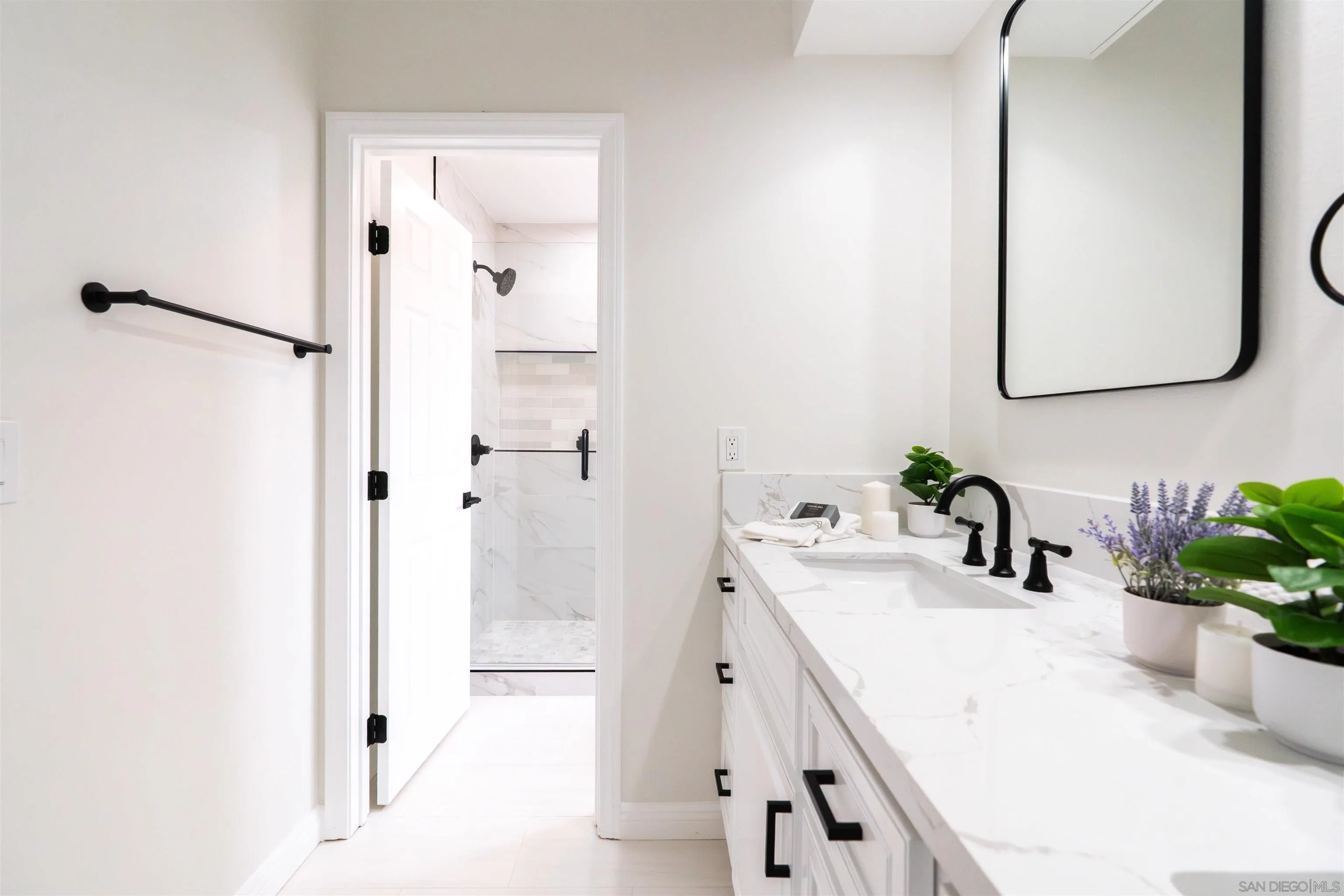 359 Compass Road Oceanside, CA 92054 - Photo 46 of 59 a bathroom with a sink and a mirror
