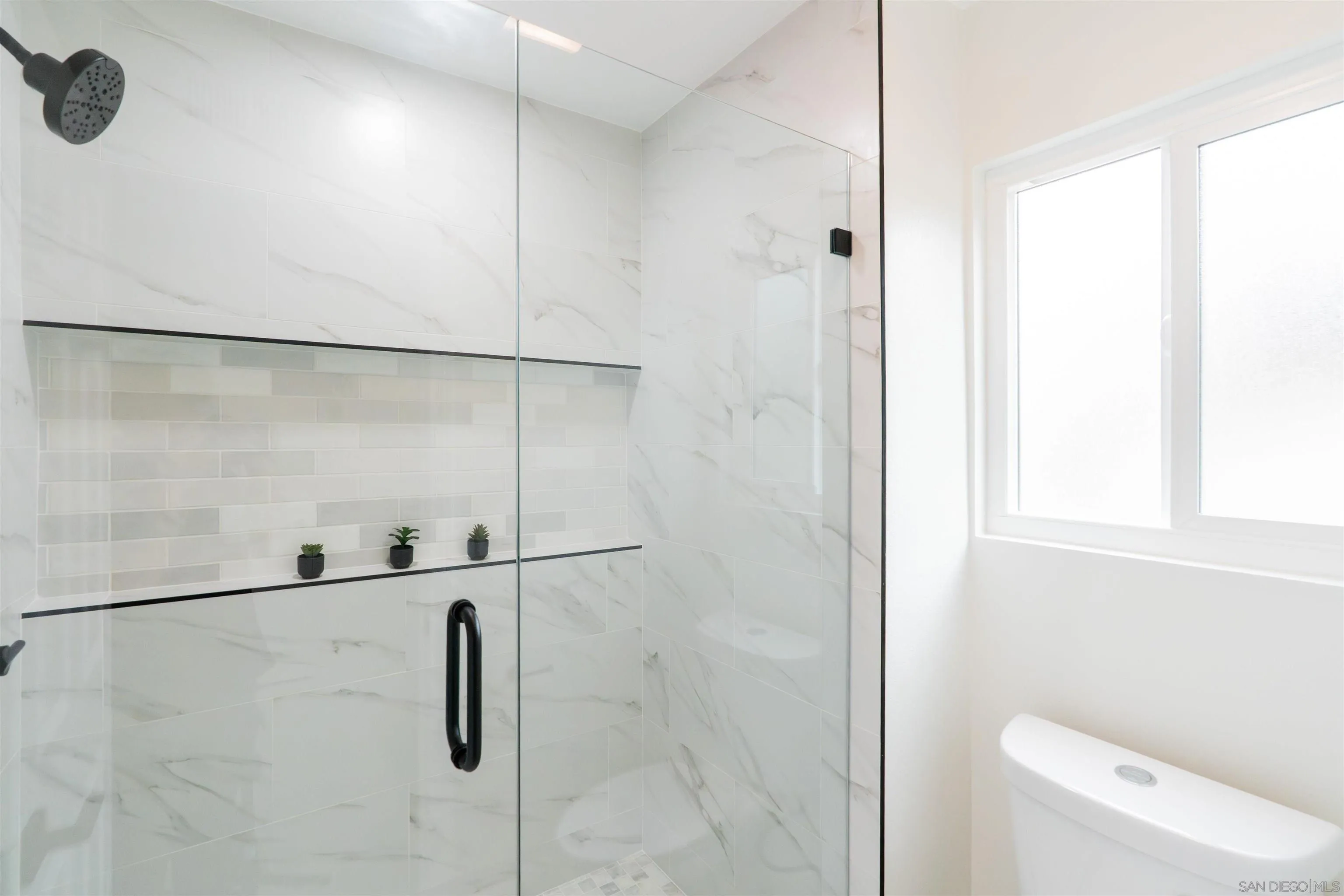 359 Compass Road Oceanside, CA 92054 - Photo 47 of 59 a bathroom with a shower and a toilet