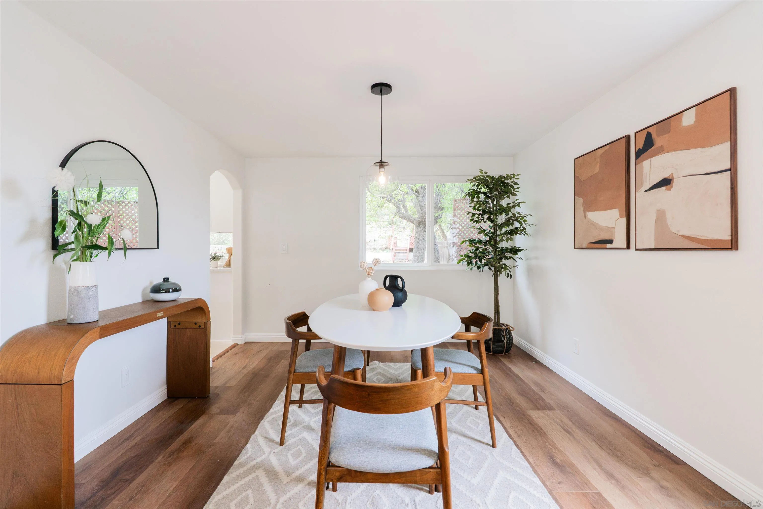 359 Compass Road Oceanside, CA 92054 - Photo 9 of 59 a dining room with furniture and a potted plant