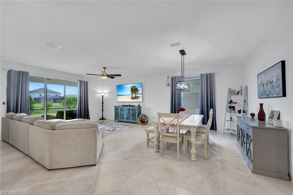 2622 Scarlet Way Naples, FL 34120 - Photo 2 of 24 a living room with furniture and a window