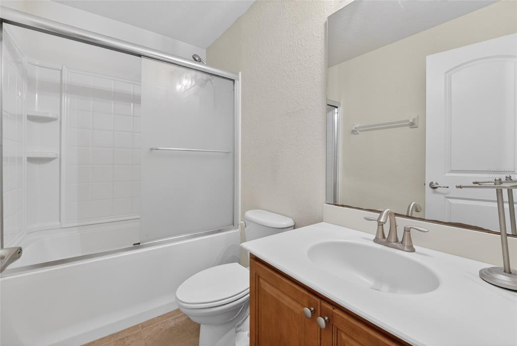 4319 Southwest 63rd Street Ocala, FL 34474 - Photo 23 of 29 a bathroom with a sink toilet and shower