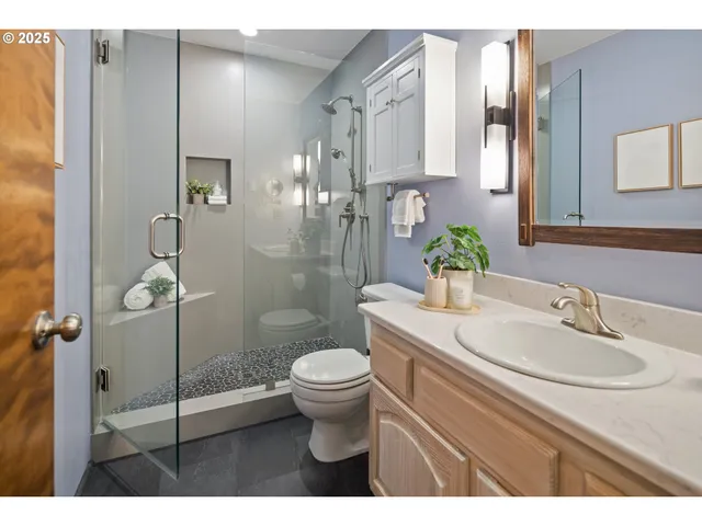 a bathroom with a sink toilet and shower