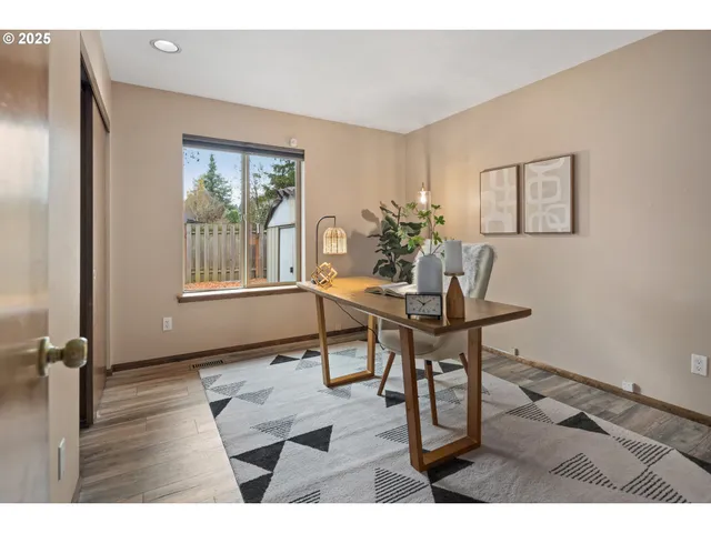 a workspace with furniture and window