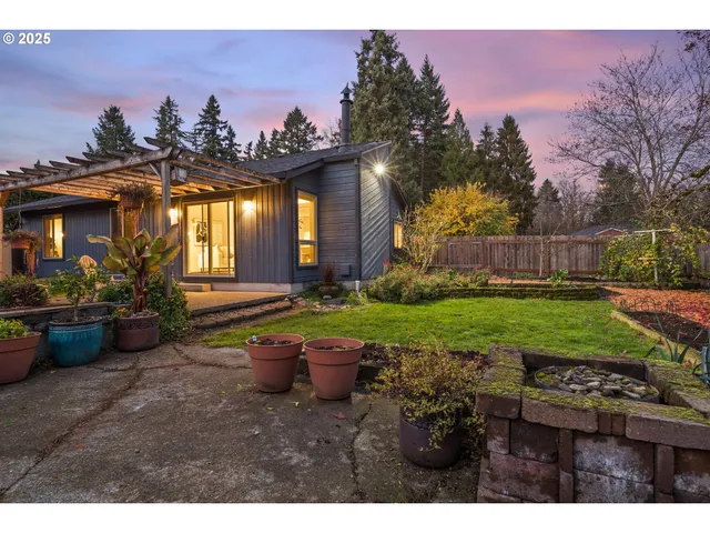 a view of a backyard with sitting area