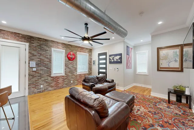 a kitchen with stainless steel appliances granite countertop a sink refrigerator and microwave