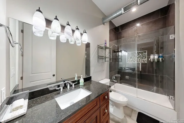 a view of a house with swimming pool and wooden floor