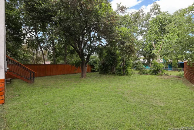 a view of outdoor space with deck and yard