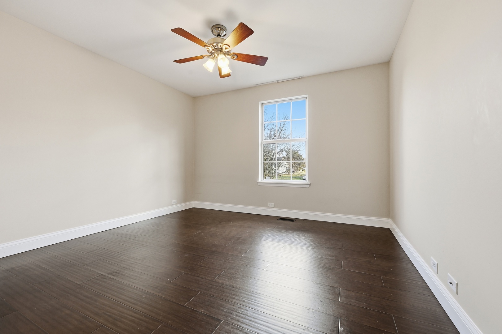 1780 Pebble Beach Circle Elgin, IL 60123 - Photo 11 of 21 an empty room with wooden floor and window