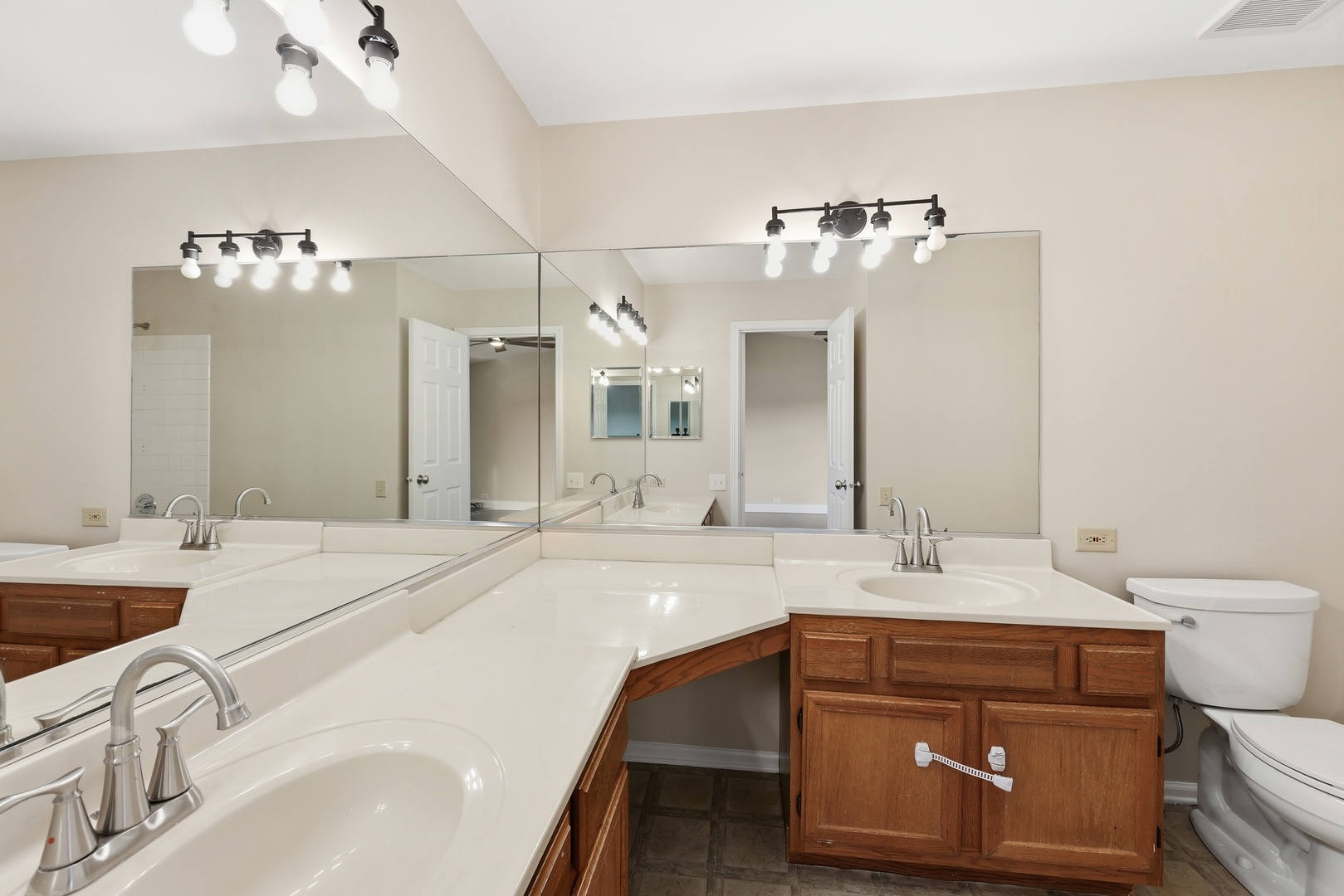 1780 Pebble Beach Circle Elgin, IL 60123 - Photo 13 of 21 a bathroom with a sink vanity and a mirror