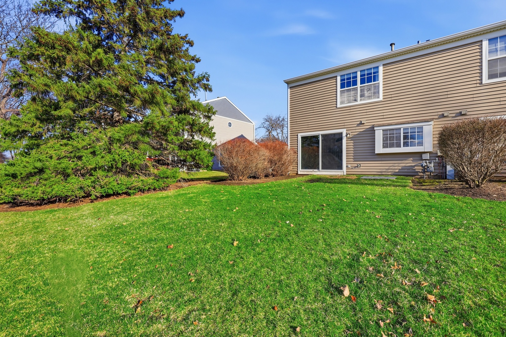 1780 Pebble Beach Circle Elgin, IL 60123 - Photo 20 of 21 a front view of house with yard and outdoor seating