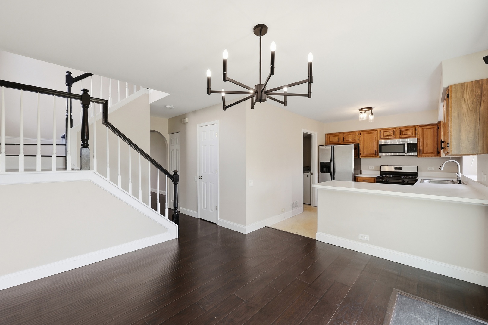 1780 Pebble Beach Circle Elgin, IL 60123 - Photo 4 of 21 a view of a livingroom with furniture a ceiling fan and wooden floor