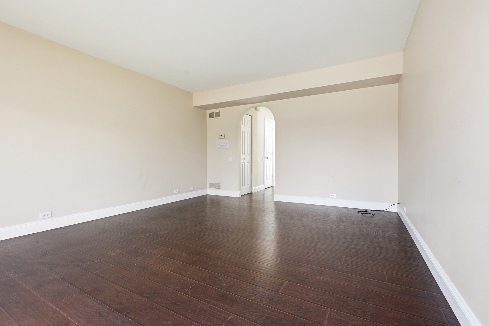 1780 Pebble Beach Circle Elgin, IL 60123 - Photo 10 of 21 an empty room with wooden floor and windows