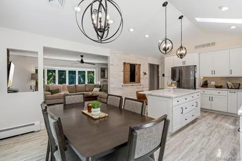 a view of kitchen with cabinets and wooden floor