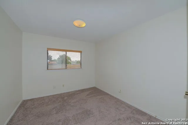 a view of empty room with a sink