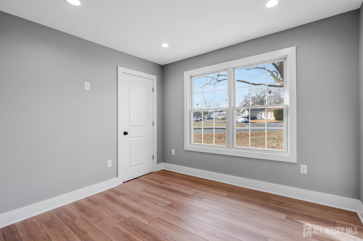 20 Louis Avenue Middlesex, NJ 08846 - Photo 12 of 22 a view of an empty room with wooden floor and a window