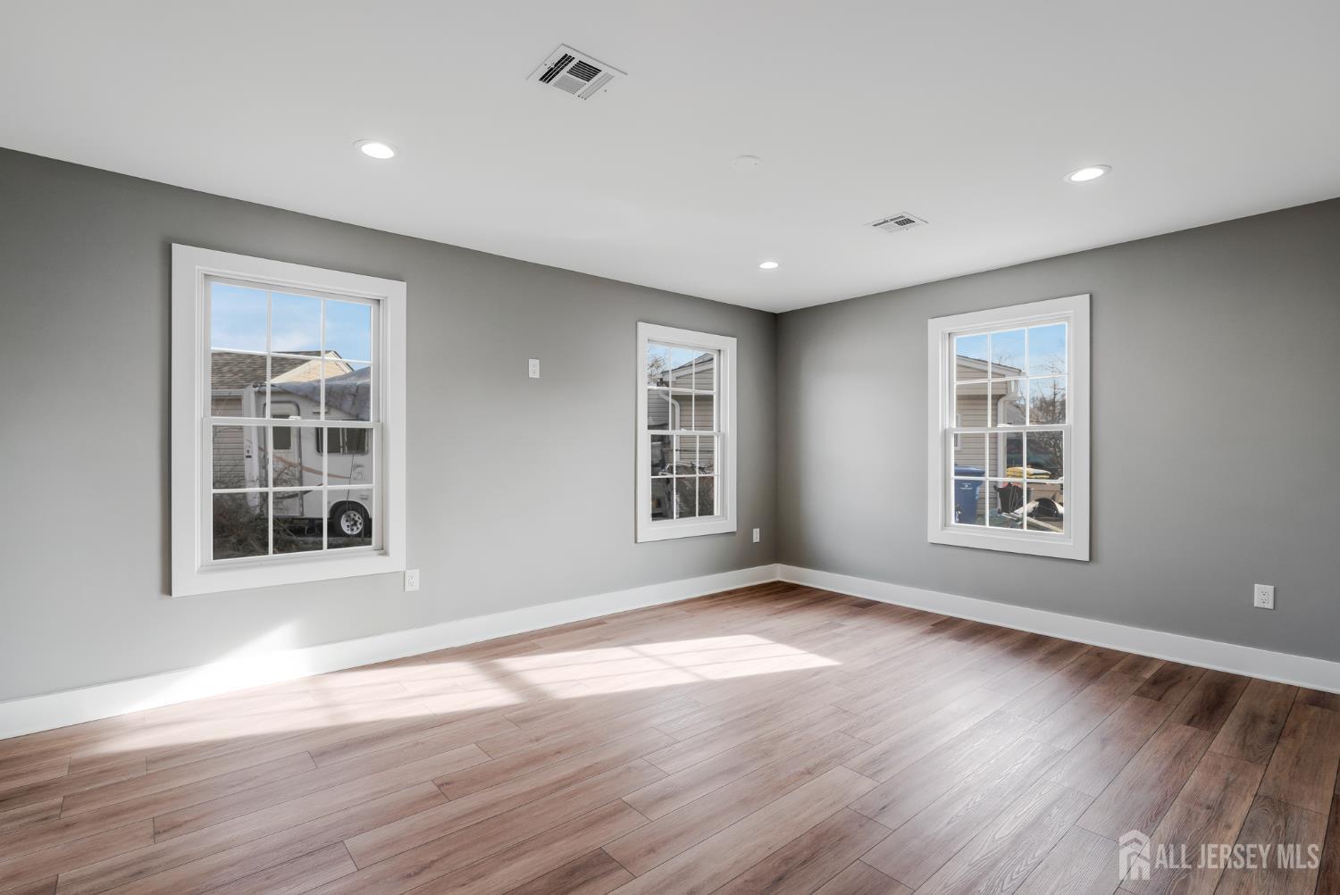 20 Louis Avenue Middlesex, NJ 08846 - Photo 14 of 22 a view of an empty room with wooden floor and a window