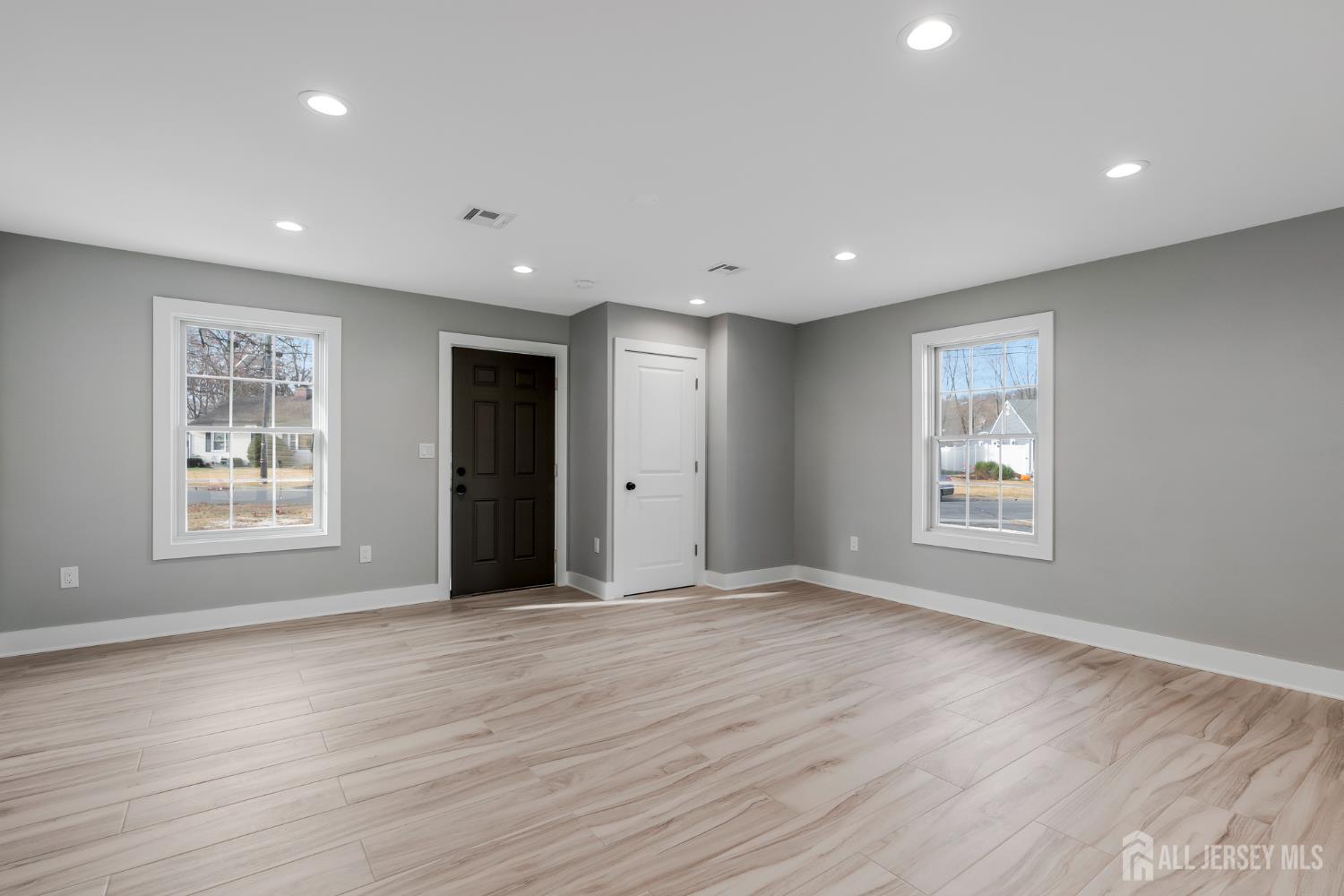 20 Louis Avenue Middlesex, NJ 08846 - Photo 4 of 22 a view of an empty room with wooden floor and a window
