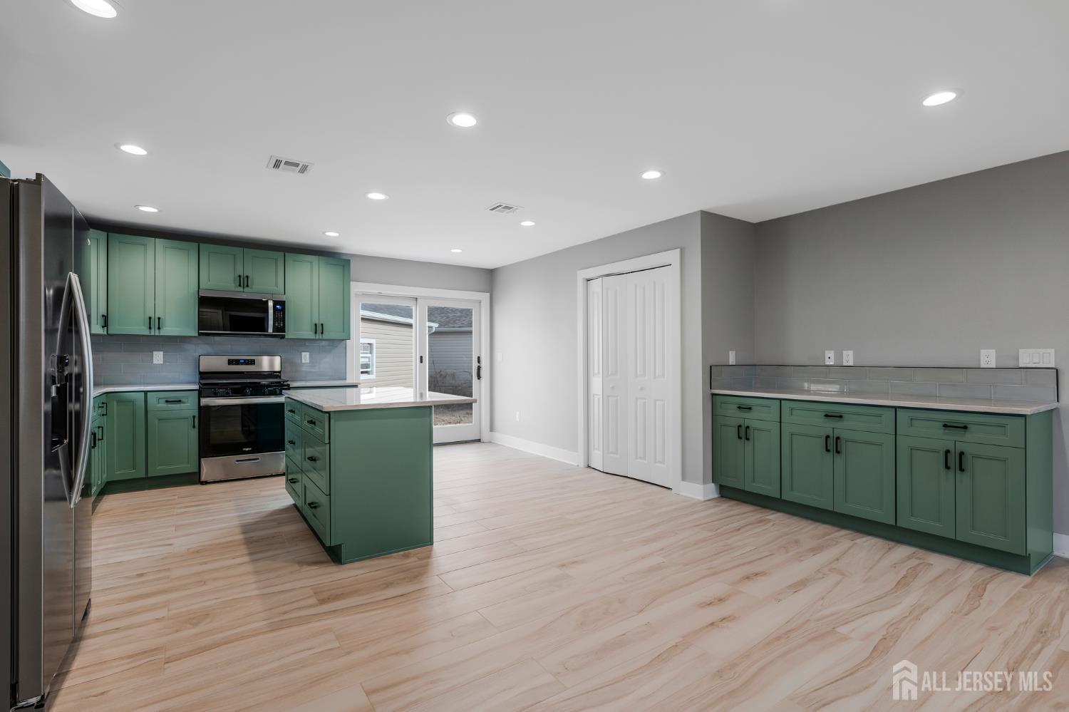 20 Louis Avenue Middlesex, NJ 08846 - Photo 9 of 22 a kitchen with a refrigerator and a sink