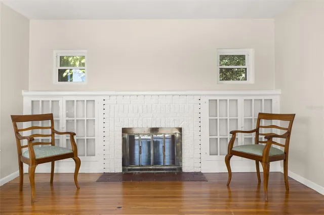 a view of a livingroom with furniture and wooden floor