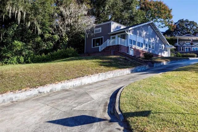 a view of a house with a yard