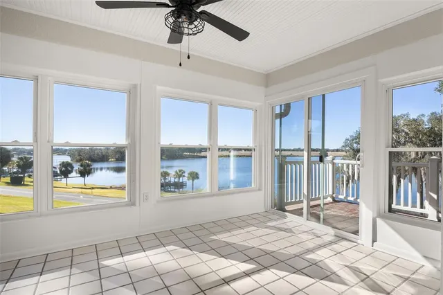 a view of an entryway with wooden floor and door