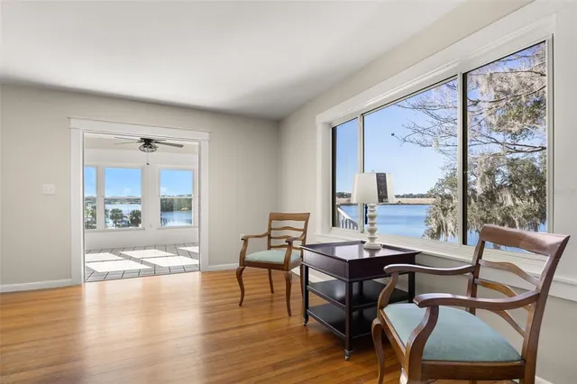 a view of a dining room with furniture window and wooden floor