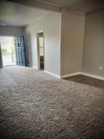 en empty room with windows and closet