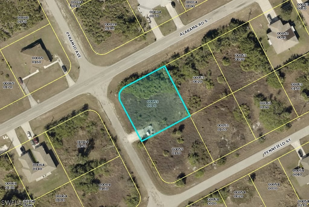 764 Alabama Road South Lehigh Acres, FL 33974 - Photo 1 of 1 an aerial view of a residential houses with outdoor space