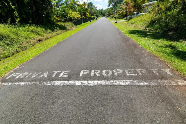 a view of a street with a park