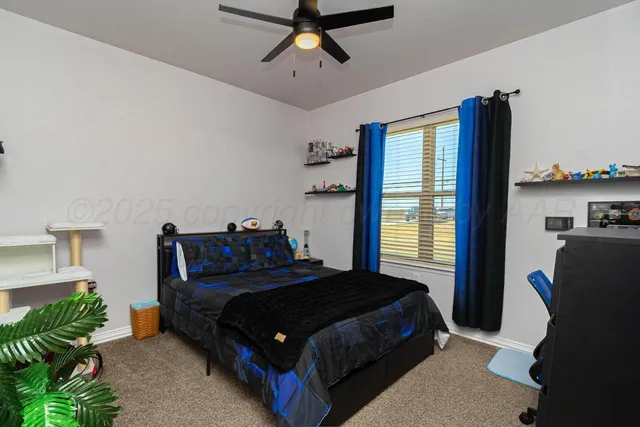 a bedroom with a bed dresser and a window