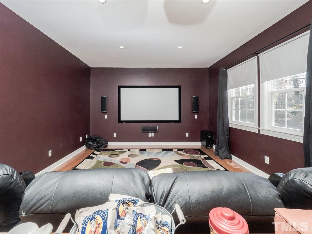 1003 Beringer Place Apex, NC 27502 - Photo 14 of 30 a bed room with a bed and a television