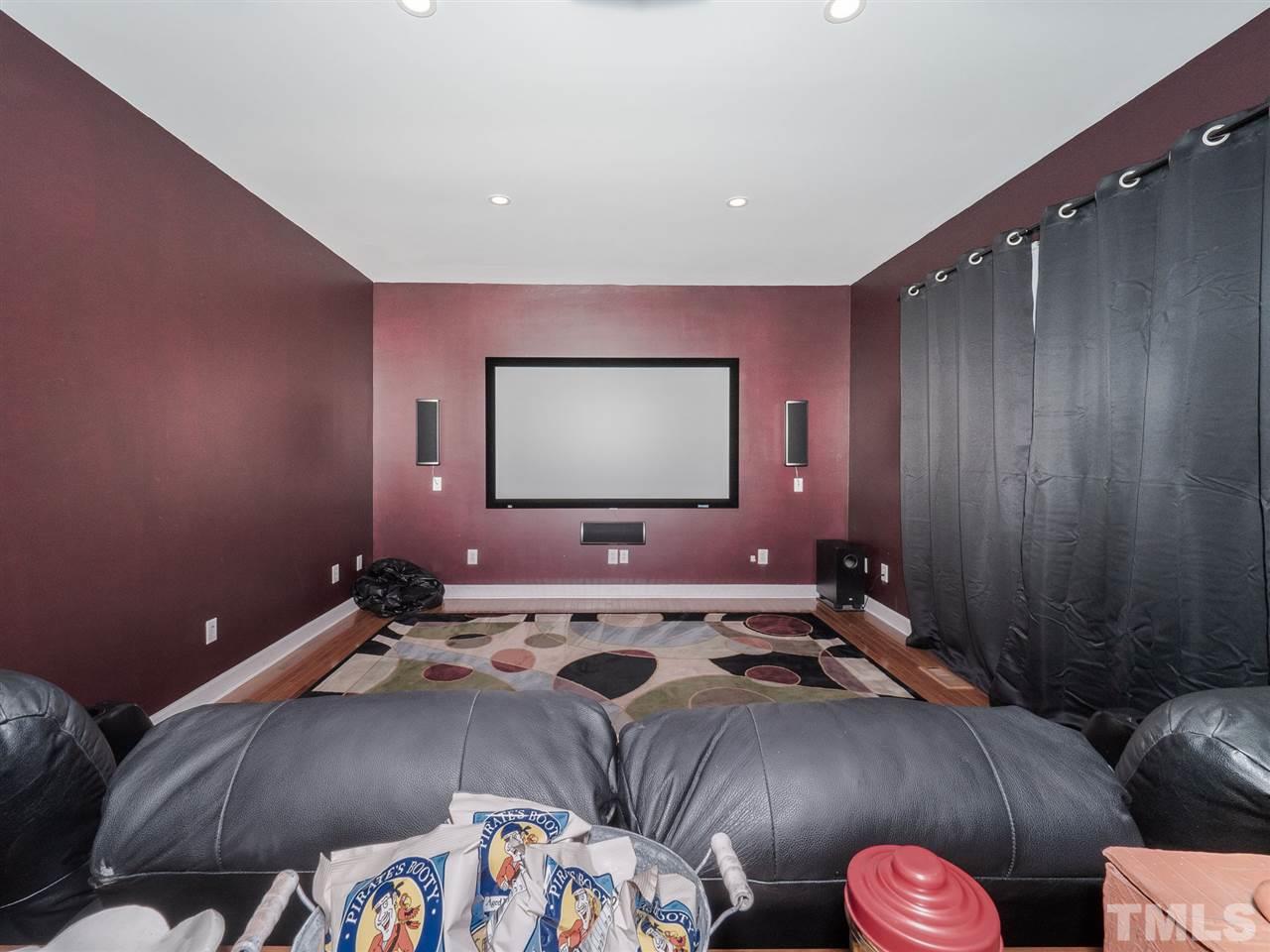 1003 Beringer Place Apex, NC 27502 - Photo 15 of 30 a bed room with a bed and a television