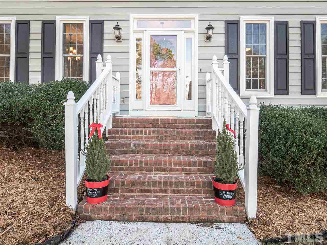 1003 Beringer Place Apex, NC 27502 - Photo 3 of 30 a front view of a house with outdoor space