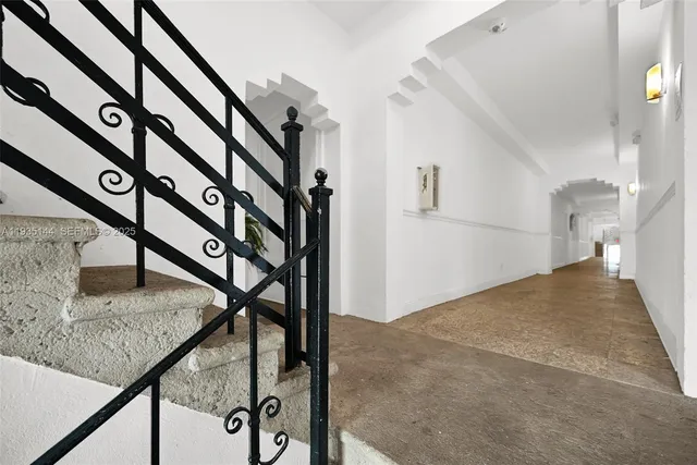 a view of a hallway with stairs