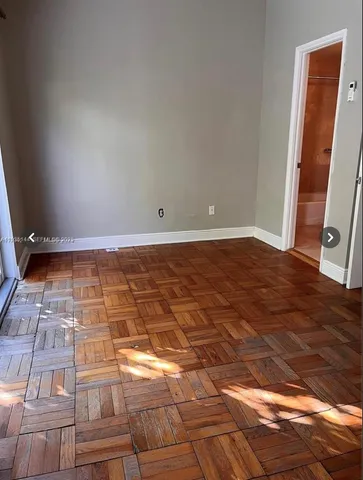 a bathroom with a toilet a sink a mirror and bathtub