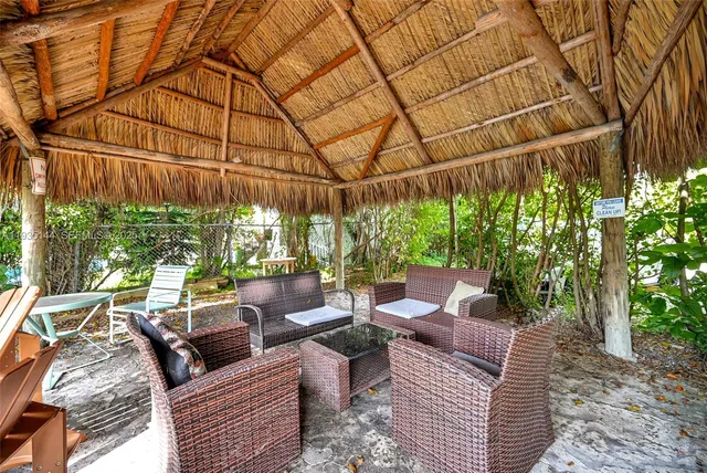 a roof deck view with a table and chairs