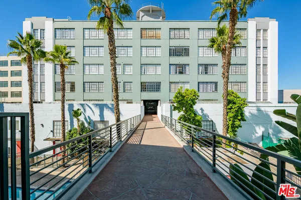 a view of a buildings with many windows