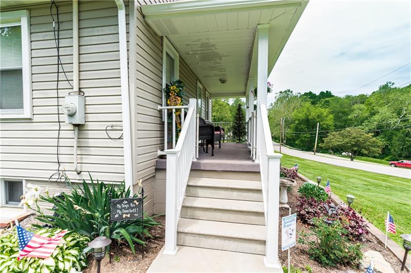 1599 Pine Run Road Rochester, PA 15074 - Photo 12 of 13 Enjoy the view on this large front porch! This is just some of the beautiful landscaping that is around the home.