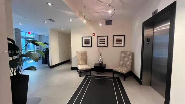 a view of a tall building next to a road