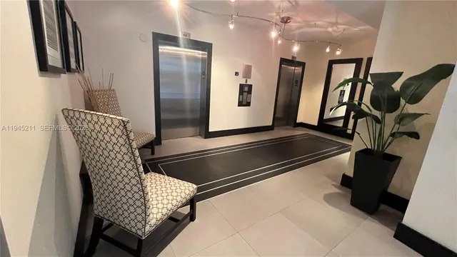 a view of an empty room with wooden shelves