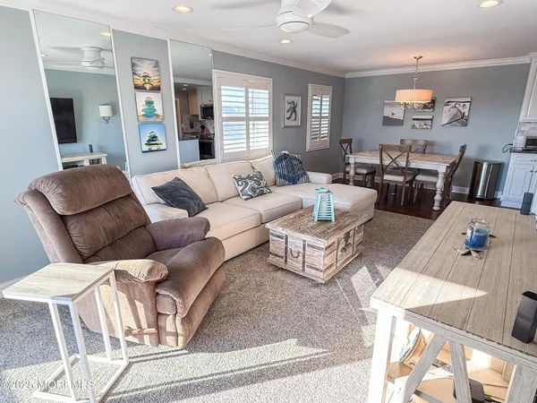 a living room with furniture or couch and a flat screen tv
