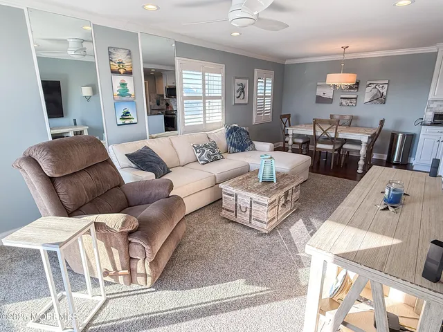a living room with furniture or couch and a flat screen tv